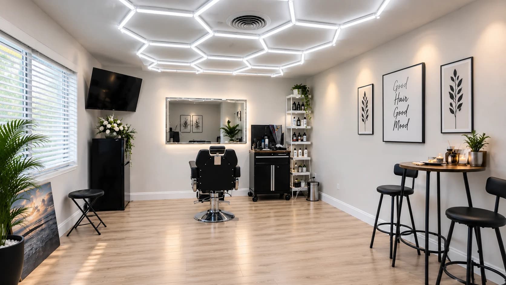Burce Sume Hair Studio in Clearwater, with a single styling chair, illuminated mirror, and warm wood floor.